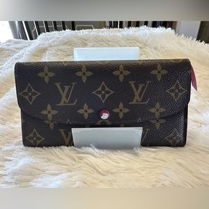 Louis Vuitton monogram wallet with red interior- snap closure